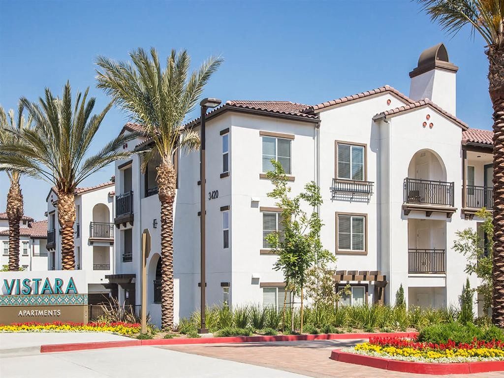 a building with palm trees in front of it